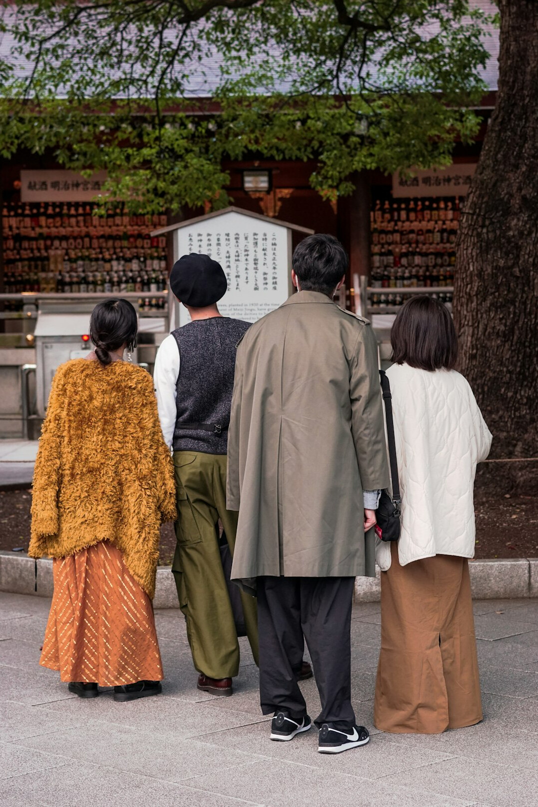 Japanese seniors checking a community activity schedule board together